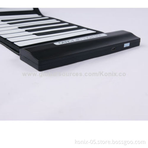 Some one play a folding roll up piano for learning